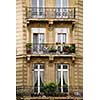 Windows and balconies of old apartment buildings in Paris France