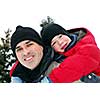 Portrait of father and son playing in winter park