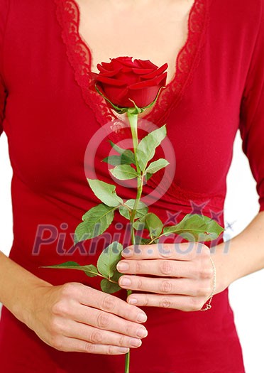 Woman in red holding a red rose Woman in red holding a red rose