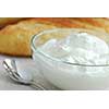 Fresh yogurt served in a clear glass bowl