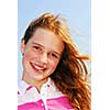 Portrait of a beautiful young girl on a breezy day outside