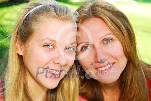 Portrait of mother and daughter in summer park Portrait of mother and daughter in summer park