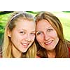 Portrait of mother and daughter in summer park