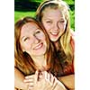 Portrait of mother and daughter in summer park
