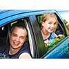 Father and daughter sitting inside the car ready to go on family trip