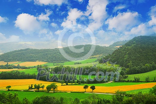 Rural landscape with hills and mountains in eastern France Rural landscape with hills and mountains in eastern France