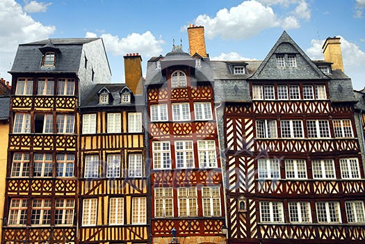 Row of crooked medieval houses in Rennes, France. Row of crooked medieval houses in Rennes, France.