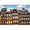 Row of crooked medieval houses in Rennes, France.