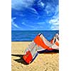 Big kite for kite surfing lying on a sandy beach