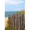 Old wooden fence on a beach in Brittany, France