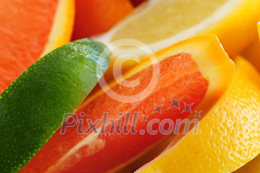 Wedges of assorted citrus fruits lemon orange and lime Wedges of assorted citrus fruits lemon orange and lime