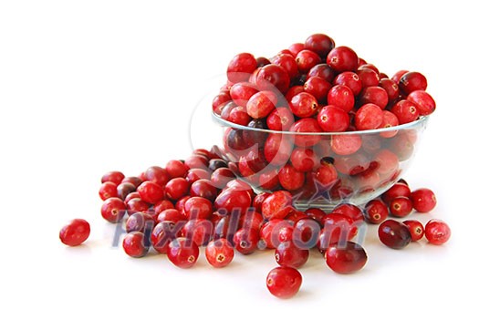 Fresh red cranberries in a glass bowl on white background Fresh red cranberries in a glass bowl on white background