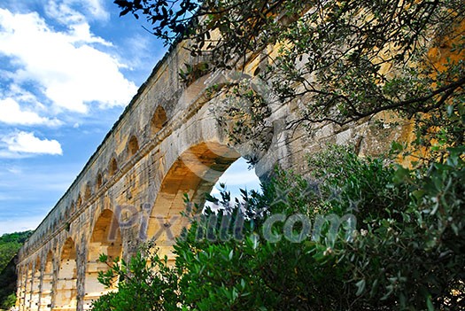 Pont du Gard is a part of Roman aqueduct in southern France near Nimes. Pont du Gard is a part of Roman aqueduct in southern France near Nimes.