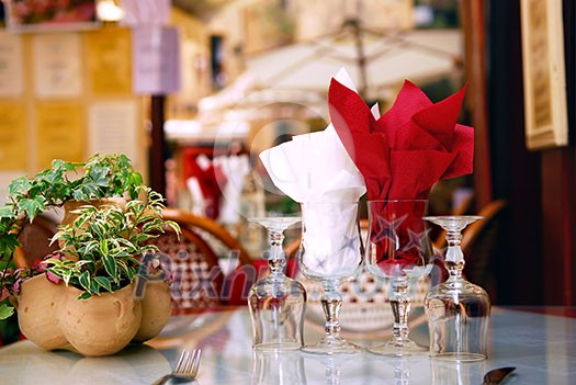 Outdoor restaurant patio on the street of Sarlat, Dordogne region, France Outdoor restaurant patio on the street of Sarlat, Dordogne region, France