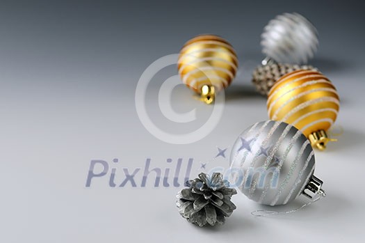 Christmas background with glass bauble ornaments and pine cones Christmas background with glass bauble ornaments and pine cones