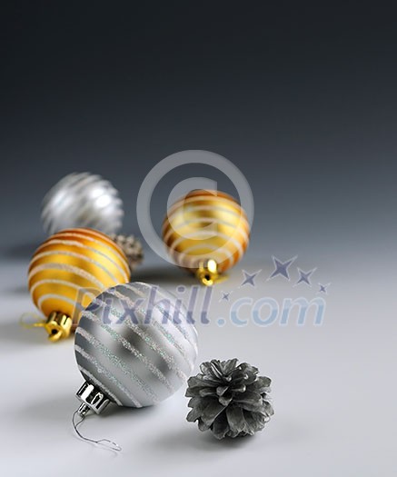 Christmas background with glass bauble ornaments and pine cones Christmas background with glass bauble ornaments and pine cones