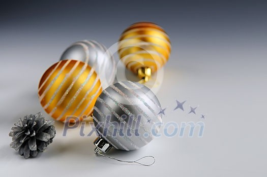 Christmas arrangement with glass bauble ornaments and pine cones Christmas arrangement with glass bauble ornaments and pine cones
