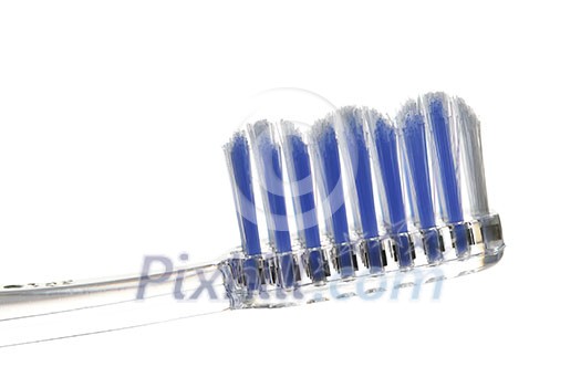 Clear toothbrush isolated on white background closeup Clear toothbrush isolated on white background closeup
