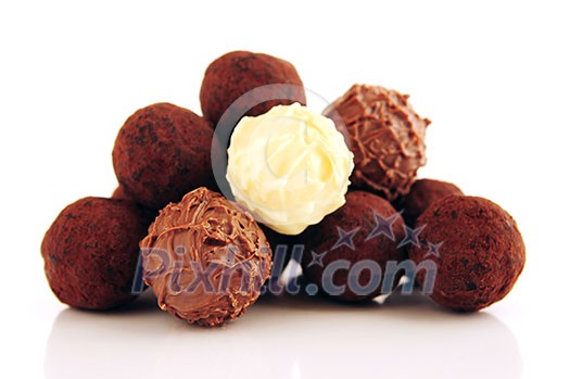 Pile of assorted chocolate truffles isolated on white background Pile of assorted chocolate truffles isolated on white background