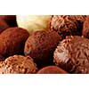 Several assorted gourmet chocolate truffles close up