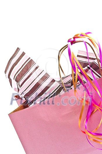 Pink shopping bag with ribbons isolated on white background Pink shopping bag with ribbons isolated on white background