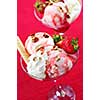 Strawberry ice cream sundae with fresh strawberries and walnuts