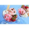 Strawberry ice cream sundae with fresh strawberries and walnuts