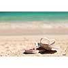 Flipflops on a sandy ocean beach - vacation concept