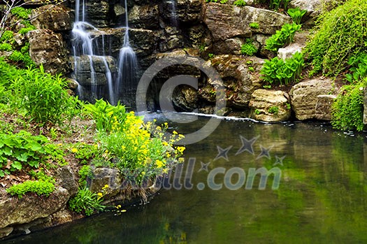 Cascading waterfall and pond in japanese garden Cascading waterfall and pond in japanese garden