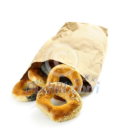 Fresh Montreal style bagels in paper bag on white background Fresh Montreal style bagels in paper bag on white background