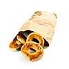 Fresh Montreal style bagels in paper bag on white background