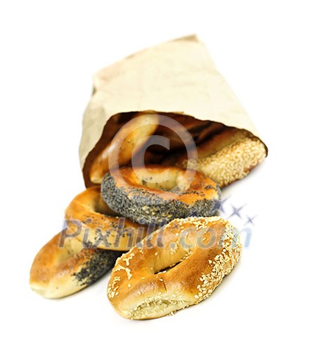 Fresh Montreal style bagels in paper bag on white background Fresh Montreal style bagels in paper bag on white background