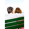 Mature romantic couple on a bench on seashore