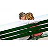 Mature romantic couple on a bench on seashore