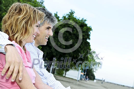 Portrait of mature romantic couple on a bench Portrait of mature romantic couple on a bench