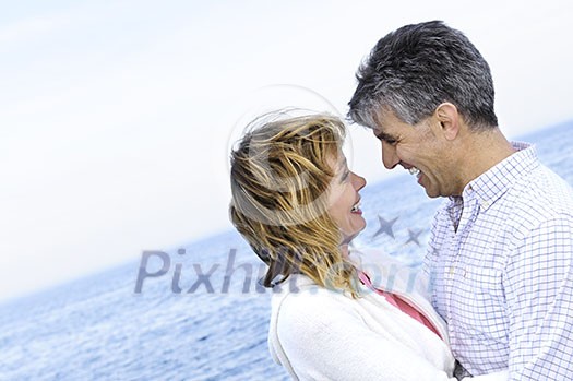 Portrait of mature romantic couple at seashore Portrait of mature romantic couple at seashore