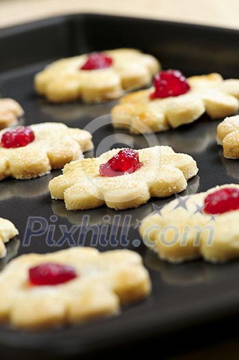 Fresh shortbread cookies on a baking tray Fresh shortbread cookies on a baking tray