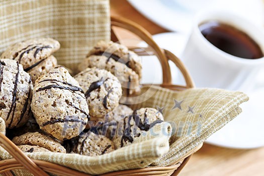 Fresh sandwich cookies in a basket and espresso coffee Fresh sandwich cookies in a basket and espresso coffee
