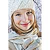 Teenage girl in winter hat with cup of hot chocolate