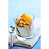 Serving of yogurt with fresh peaches and granola