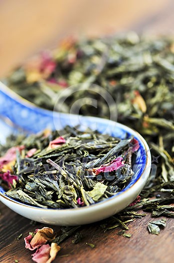 Green tea loose dry leaves in a spoon Green tea loose dry leaves in a spoon