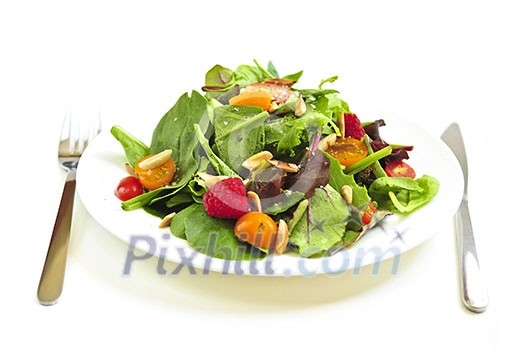 Plate of fresh green salad isolated on white background Plate of fresh green salad isolated on white background
