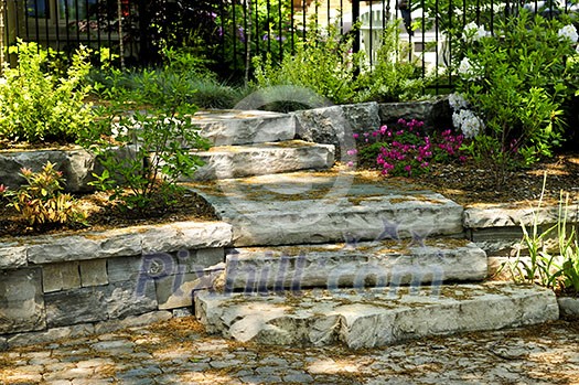 Landscaped front yard with natural stone steps and walkway Landscaped front yard with natural stone steps and walkway