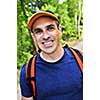 Portrait of happy middle aged man on a forest trail