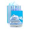 Gift bags and infant clothes for baby shower isolated on white
