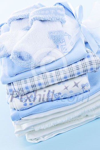 Stack of blue infant clothing for baby shower Stack of blue infant clothing for baby shower