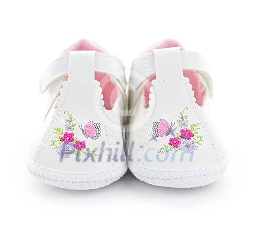 Closeup of girl baby shoes isolated on white background Closeup of girl baby shoes isolated on white background