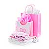 Pink gift bags and infant clothes for girl baby shower isolated on white