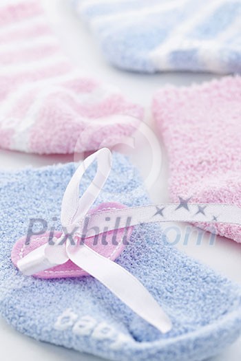 Pink and blue infant socks for baby shower with ribbon Pink and blue infant socks for baby shower with ribbon