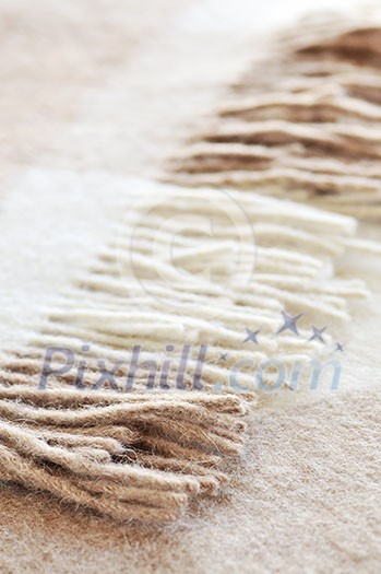 Soft and warm folded alpaca wool blanket with fringe Soft and warm folded alpaca wool blanket with fringe